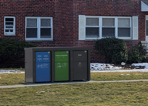 Grey Cart Recycling Housings,3x65 gallon Carts in front of Multifamily unit